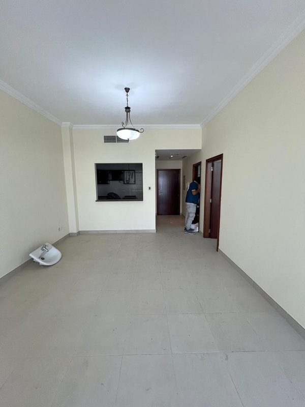 Living room before the works, looking towards the entrance with the old kitchen hatch on the left