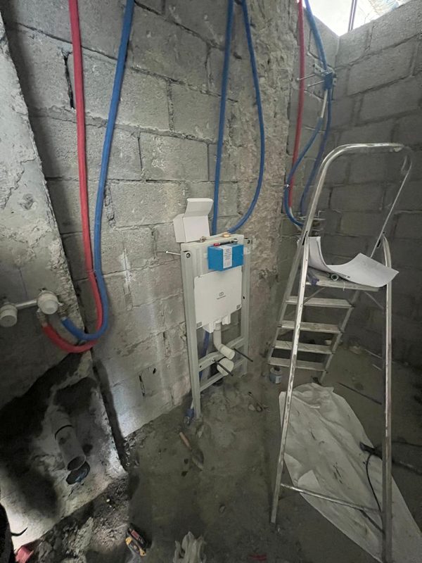 Concealed WC cistern frame fixed to new blockwork in the master bathroom